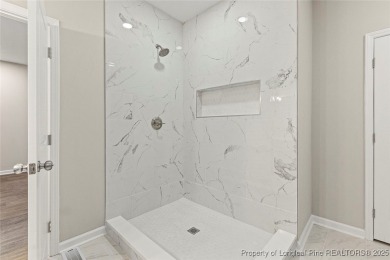 This lovely new construction home is located in the friendly on Carolina Trace Country Club in North Carolina - for sale on GolfHomes.com, golf home, golf lot