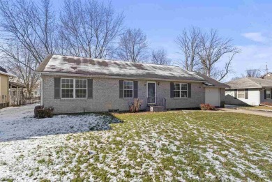 This attractive brick home sits on a quiet neighborhood block in on Lagos Acres Golf Course in Iowa - for sale on GolfHomes.com, golf home, golf lot