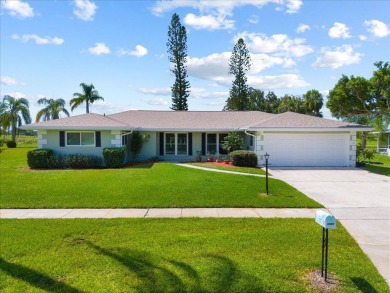 Tucked along a quiet stretch of Sandpiper Bay, this home blends on Club Med Sandpiper in Florida - for sale on GolfHomes.com, golf home, golf lot