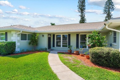 Tucked along a quiet stretch of Sandpiper Bay, this home blends on Club Med Sandpiper in Florida - for sale on GolfHomes.com, golf home, golf lot