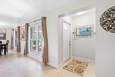 Tucked along a quiet stretch of Sandpiper Bay, this home blends on Club Med Sandpiper in Florida - for sale on GolfHomes.com, golf home, golf lot
