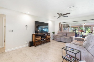 Tucked along a quiet stretch of Sandpiper Bay, this home blends on Club Med Sandpiper in Florida - for sale on GolfHomes.com, golf home, golf lot