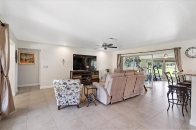 Tucked along a quiet stretch of Sandpiper Bay, this home blends on Club Med Sandpiper in Florida - for sale on GolfHomes.com, golf home, golf lot
