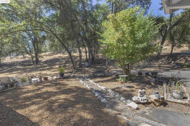 Tucked away on a peaceful cul-de-sac in the beautiful gated on Pine Mountain Lake Country Club in California - for sale on GolfHomes.com, golf home, golf lot