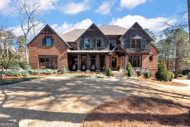 Nestled on a private .88-acre wooded lot in the prestigious on The River Club in Georgia - for sale on GolfHomes.com, golf home, golf lot