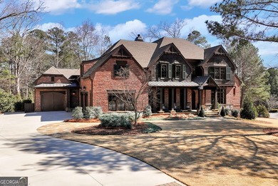 Nestled on a private .88-acre wooded lot in the prestigious on The River Club in Georgia - for sale on GolfHomes.com, golf home, golf lot