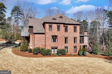 Nestled on a private .88-acre wooded lot in the prestigious on The River Club in Georgia - for sale on GolfHomes.com, golf home, golf lot
