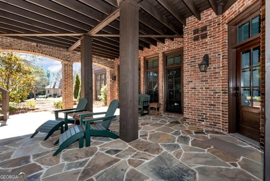 Nestled on a private .88-acre wooded lot in the prestigious on The River Club in Georgia - for sale on GolfHomes.com, golf home, golf lot