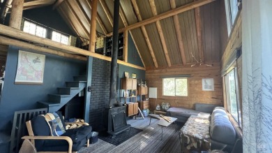 A cozy little log cabin. Two bedrooms, one is in the large open on Terrace Lakes Golf Resort in Idaho - for sale on GolfHomes.com, golf home, golf lot