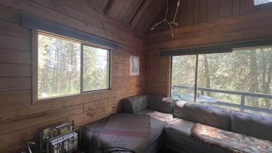 A cozy little log cabin. Two bedrooms, one is in the large open on Terrace Lakes Golf Resort in Idaho - for sale on GolfHomes.com, golf home, golf lot