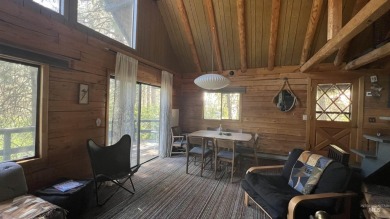 A cozy little log cabin. Two bedrooms, one is in the large open on Terrace Lakes Golf Resort in Idaho - for sale on GolfHomes.com, golf home, golf lot