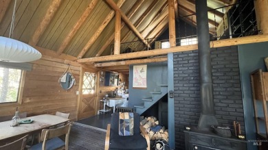 A cozy little log cabin. Two bedrooms, one is in the large open on Terrace Lakes Golf Resort in Idaho - for sale on GolfHomes.com, golf home, golf lot