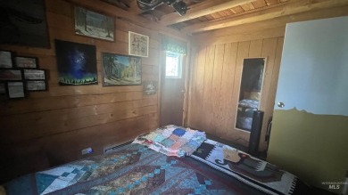 A cozy little log cabin. Two bedrooms, one is in the large open on Terrace Lakes Golf Resort in Idaho - for sale on GolfHomes.com, golf home, golf lot
