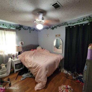 Discover this 3-bedroom, 2-bathroom home nestled right on the on Pass Christian Isles Golf Club in Mississippi - for sale on GolfHomes.com, golf home, golf lot