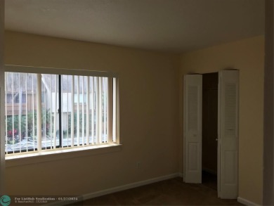 THIS 3 BEDROOM 2 BATH CONDO HAS NEW PAINT, NEW CARPET AND HAS on Jacaranda Golf Club in Florida - for sale on GolfHomes.com, golf home, golf lot