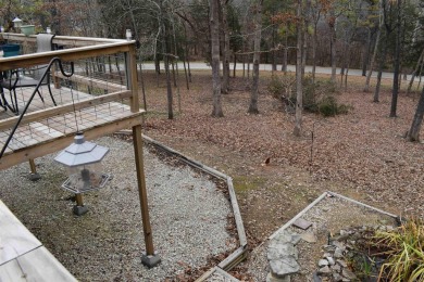 This property is within walking distance to golf course, close on Cherokee Village North Course in Arkansas - for sale on GolfHomes.com, golf home, golf lot