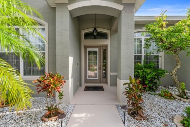 Gorgeous pool home nestled on a quiet street in the highly on Plantation Bay Golf and Country Club in Florida - for sale on GolfHomes.com, golf home, golf lot