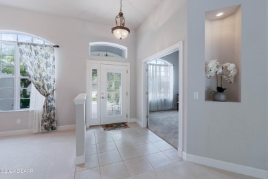 Gorgeous pool home nestled on a quiet street in the highly on Plantation Bay Golf and Country Club in Florida - for sale on GolfHomes.com, golf home, golf lot