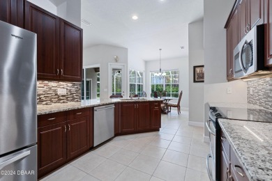 Gorgeous pool home nestled on a quiet street in the highly on Plantation Bay Golf and Country Club in Florida - for sale on GolfHomes.com, golf home, golf lot
