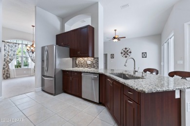 Gorgeous pool home nestled on a quiet street in the highly on Plantation Bay Golf and Country Club in Florida - for sale on GolfHomes.com, golf home, golf lot