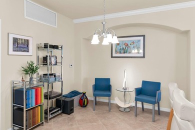 Enjoy a first-floor end-unit coach home with beautiful lake on The Rookery At Marco in Florida - for sale on GolfHomes.com, golf home, golf lot