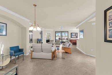 Enjoy a first-floor end-unit coach home with beautiful lake on The Rookery At Marco in Florida - for sale on GolfHomes.com, golf home, golf lot