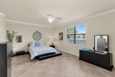Enjoy a first-floor end-unit coach home with beautiful lake on The Rookery At Marco in Florida - for sale on GolfHomes.com, golf home, golf lot