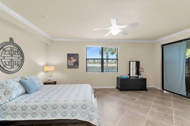 Enjoy a first-floor end-unit coach home with beautiful lake on The Rookery At Marco in Florida - for sale on GolfHomes.com, golf home, golf lot