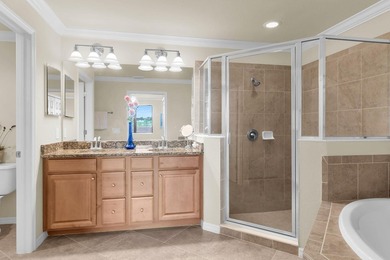 Enjoy a first-floor end-unit coach home with beautiful lake on The Rookery At Marco in Florida - for sale on GolfHomes.com, golf home, golf lot