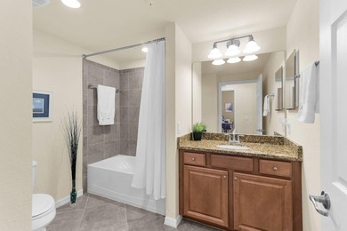 Enjoy a first-floor end-unit coach home with beautiful lake on The Rookery At Marco in Florida - for sale on GolfHomes.com, golf home, golf lot