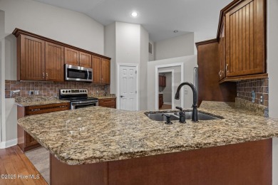 Located in the gated Woodlake Country Club community.

Tucked on Woodlake Country Club in North Carolina - for sale on GolfHomes.com, golf home, golf lot