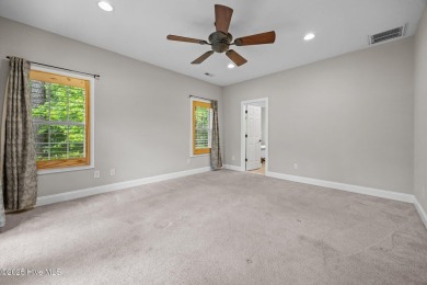 Located in the gated Woodlake Country Club community.

Tucked on Woodlake Country Club in North Carolina - for sale on GolfHomes.com, golf home, golf lot