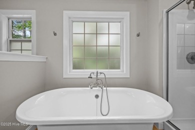Located in the gated Woodlake Country Club community.

Tucked on Woodlake Country Club in North Carolina - for sale on GolfHomes.com, golf home, golf lot