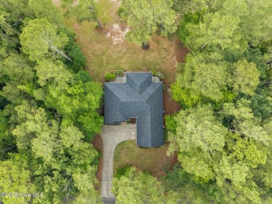 Located in the gated Woodlake Country Club community.

Tucked on Woodlake Country Club in North Carolina - for sale on GolfHomes.com, golf home, golf lot