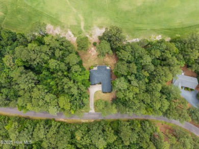 Located in the gated Woodlake Country Club community.

Tucked on Woodlake Country Club in North Carolina - for sale on GolfHomes.com, golf home, golf lot