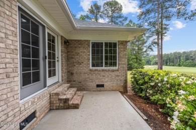 Located in the gated Woodlake Country Club community.

Tucked on Woodlake Country Club in North Carolina - for sale on GolfHomes.com, golf home, golf lot