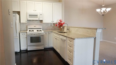 Welcome to 701 Masters Row, an exceptional third-floor corner on The Tradition Golf Club At The Crossings in Virginia - for sale on GolfHomes.com, golf home, golf lot