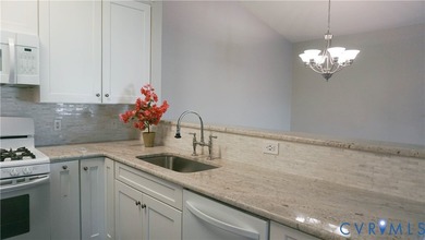 Welcome to 701 Masters Row, an exceptional third-floor corner on The Tradition Golf Club At The Crossings in Virginia - for sale on GolfHomes.com, golf home, golf lot