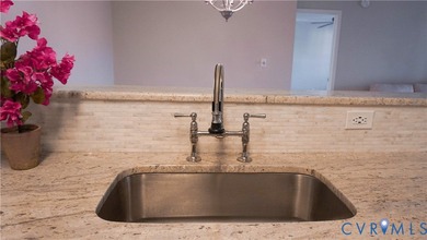 Welcome to 701 Masters Row, an exceptional third-floor corner on The Tradition Golf Club At The Crossings in Virginia - for sale on GolfHomes.com, golf home, golf lot