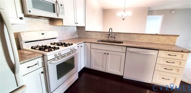 Welcome to 701 Masters Row, an exceptional third-floor corner on The Tradition Golf Club At The Crossings in Virginia - for sale on GolfHomes.com, golf home, golf lot