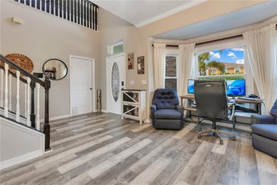 Welcome to this updated 4-bedroom, 3-bath pool home with a loft on North Shore Golf Club in Florida - for sale on GolfHomes.com, golf home, golf lot