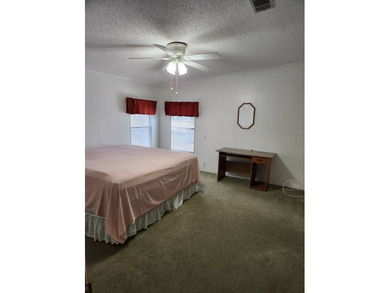 This spacious 2-bed/2-bath home with a den/family room situated on Spanish Lakes Fairways in Florida - for sale on GolfHomes.com, golf home, golf lot