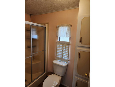 This spacious 2-bed/2-bath home with a den/family room situated on Spanish Lakes Fairways in Florida - for sale on GolfHomes.com, golf home, golf lot