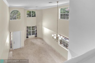 Discover this beautiful 2-story residence at the gated community on Palm-Aire Country Club and Resort - The Oaks in Florida - for sale on GolfHomes.com, golf home, golf lot