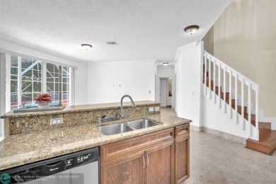 Discover this beautiful 2-story residence at the gated community on Palm-Aire Country Club and Resort - The Oaks in Florida - for sale on GolfHomes.com, golf home, golf lot