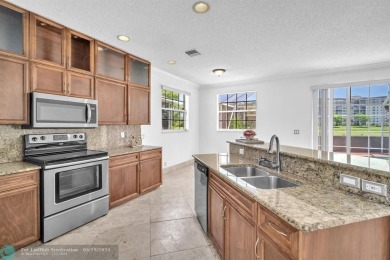 Discover this beautiful 2-story residence at the gated community on Palm-Aire Country Club and Resort - The Oaks in Florida - for sale on GolfHomes.com, golf home, golf lot