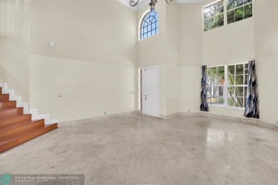 Discover this beautiful 2-story residence at the gated community on Palm-Aire Country Club and Resort - The Oaks in Florida - for sale on GolfHomes.com, golf home, golf lot
