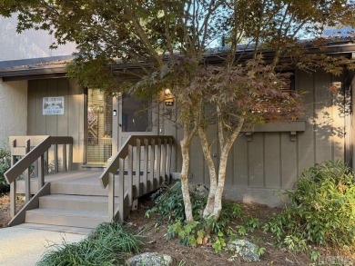 Perched above Fairfield lake, this extensively renovated modern on The Country Club of Sapphire Valley in North Carolina - for sale on GolfHomes.com, golf home, golf lot