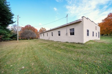 FIVE BEDROOM, expansive first floor home on ALMOST 5.0 acres in on Hickory Hills Golf Club in Michigan - for sale on GolfHomes.com, golf home, golf lot