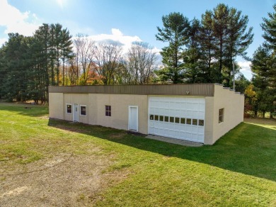 FIVE BEDROOM, expansive first floor home on ALMOST 5.0 acres in on Hickory Hills Golf Club in Michigan - for sale on GolfHomes.com, golf home, golf lot